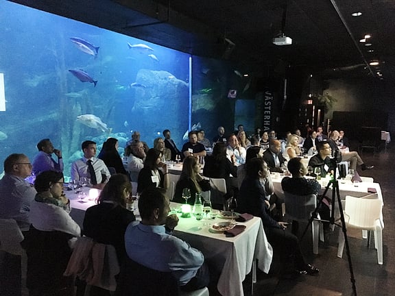 Attendees Seated in front of Aquarium